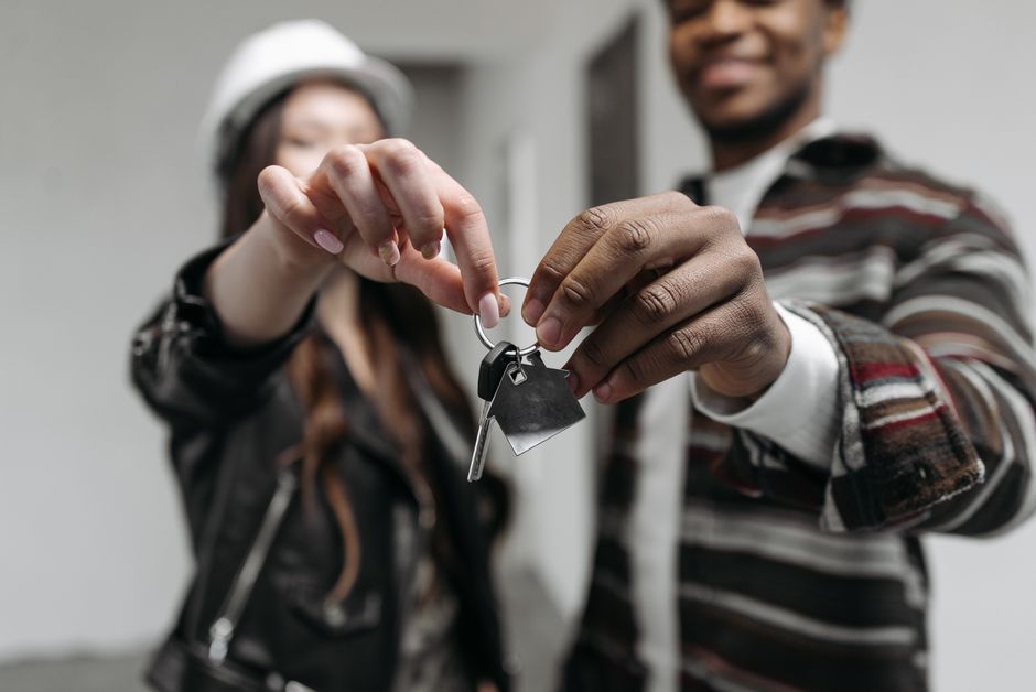 Keys to a new house resting on a packed box